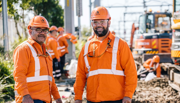 men wearing orange safety gear